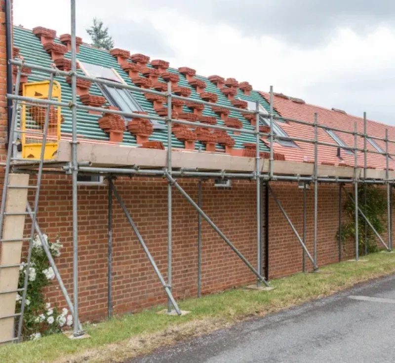 New roof being tiled with scaffolding